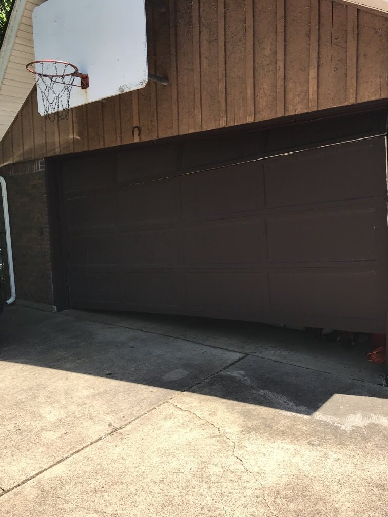 Broken garage door before