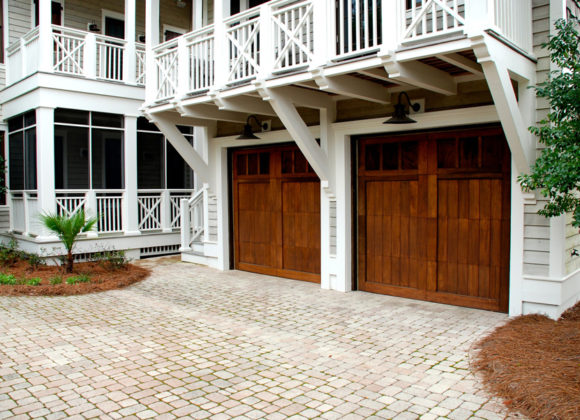 Brown Garage Doors on 2-Story Home from a Garage Door Buying Guide for Rowlett, Dallas, Fort Worth, Allen, Plano, McKinney, TX