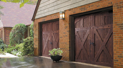 Front of House with Wood Composite Garage Doors in Dallas, Fort Worth, McKinney, Plano, and Richardson