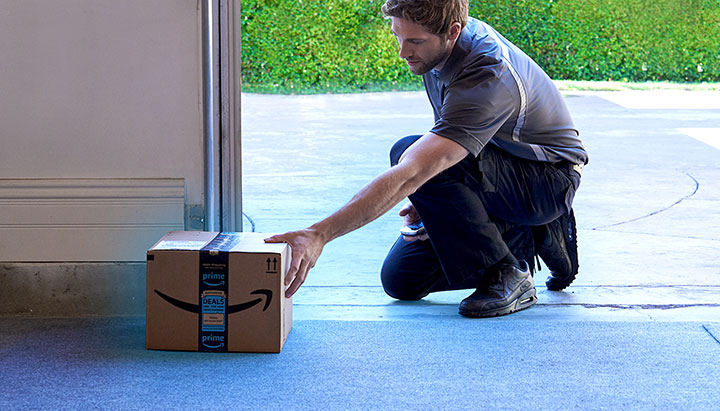 Man testing the garage after a garage door track replacement in Fort Worth