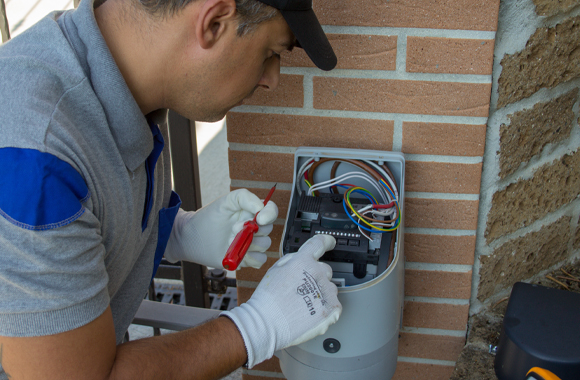 technician providing Emergency Overhead Door Repair in Dallas, Fort Worth, Garland, Plano, Rowlett